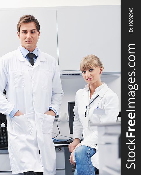 Science and research biology chemistry an dmedicine youn people couple in bright modern lab. Science and research biology chemistry an dmedicine youn people couple in bright modern lab