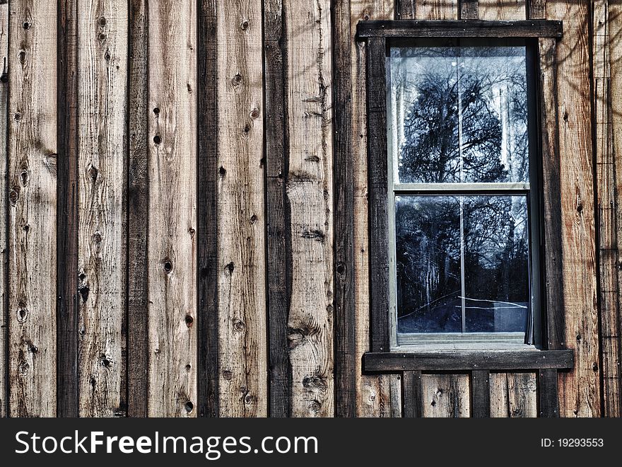 A window on the side of an old house. HDR. A window on the side of an old house. HDR