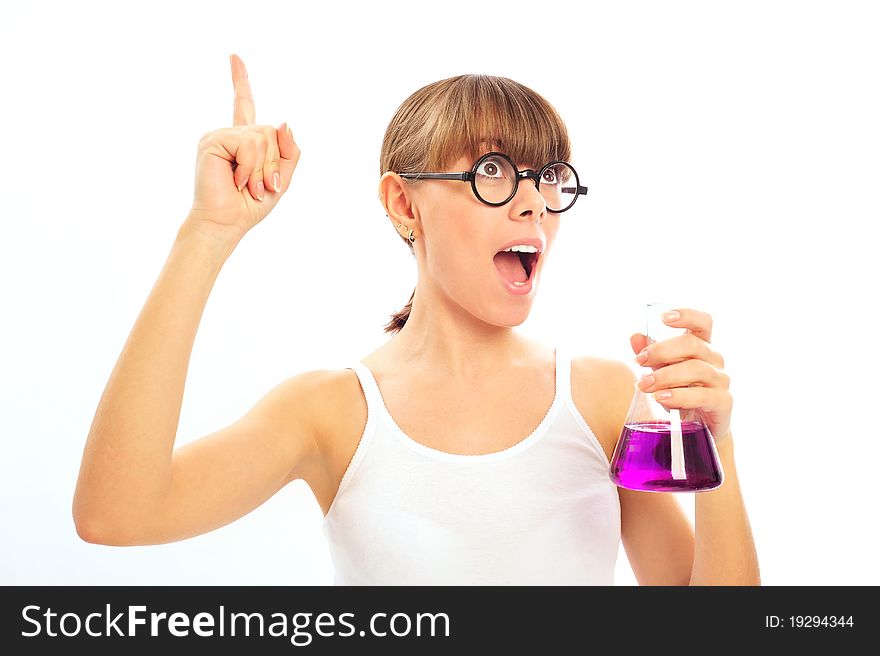 Beautiful young scientist holds up a flask while showing a flash of inspiration. Horizontal shot. Beautiful young scientist holds up a flask while showing a flash of inspiration. Horizontal shot.