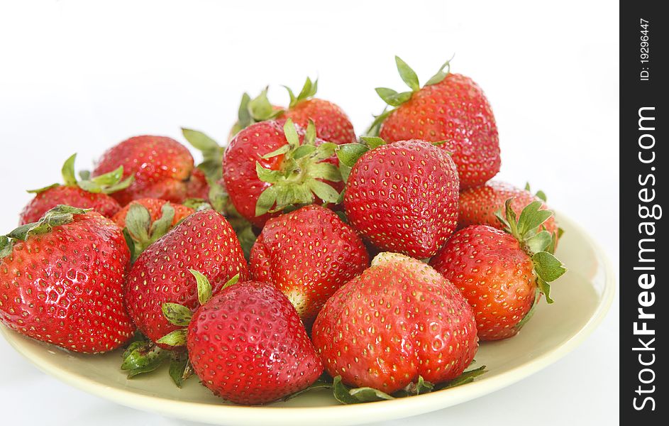 Pile of fresh strawberries on the plate