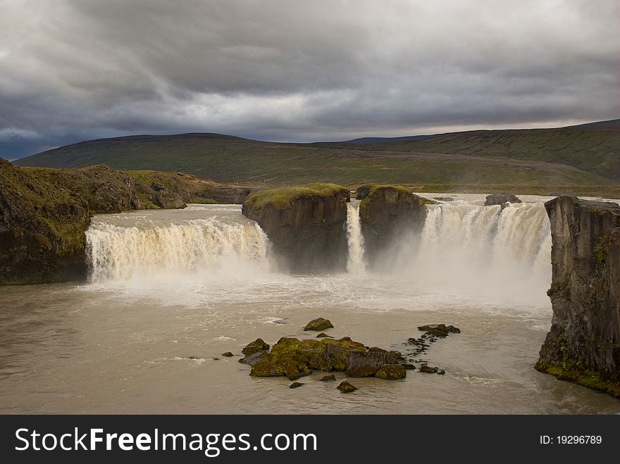 Godafoss waterfalls with mountain in Iceland. Famous touristic attraction