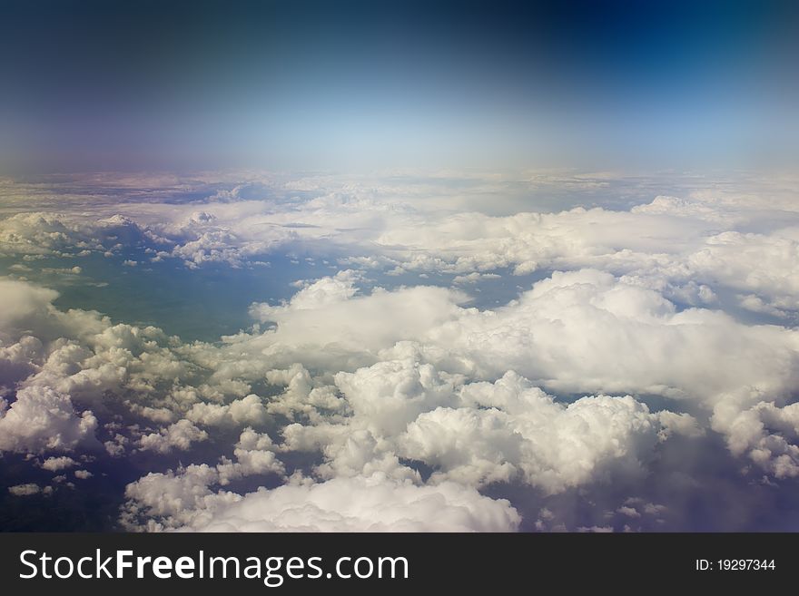 Kind on clouds on a background a firmament from an airplane