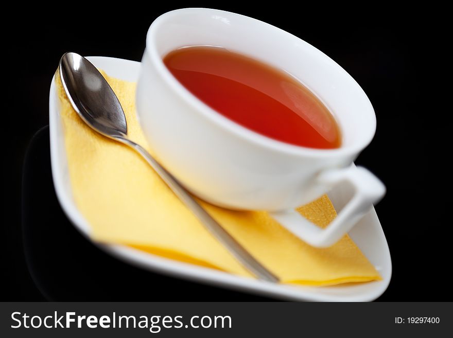 Tea Cup And Tea Spoon On Black Background