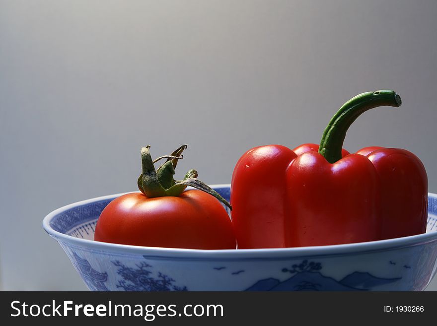 Vegetable in bowl - tomato and pepper. Vegetable in bowl - tomato and pepper.