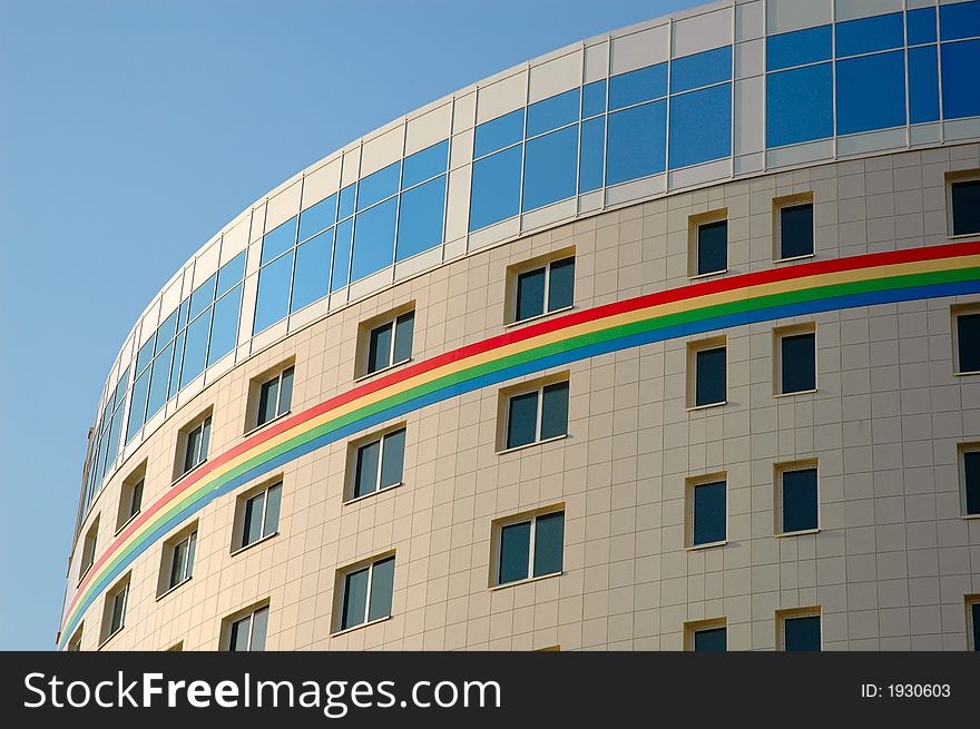 Modern business building with rainbow