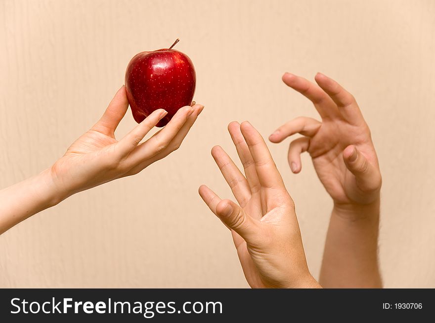 Hands and apple