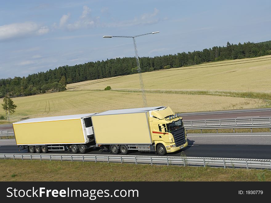 Clean Yellow Truck In Country Surrounding