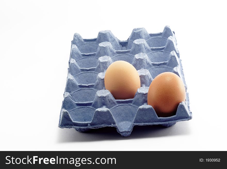 Two eggs with blue cardboard