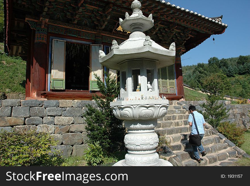 An man worships at a Buddhist temple near Geumsan, South Korea. An man worships at a Buddhist temple near Geumsan, South Korea