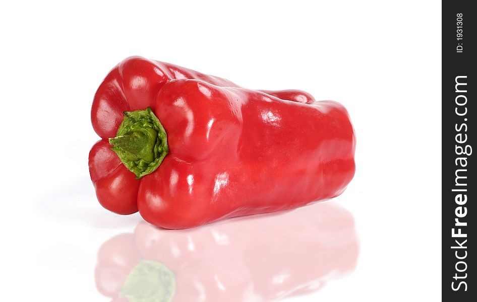 A red pepperone from Italy on a white lucid plan. A red pepperone from Italy on a white lucid plan