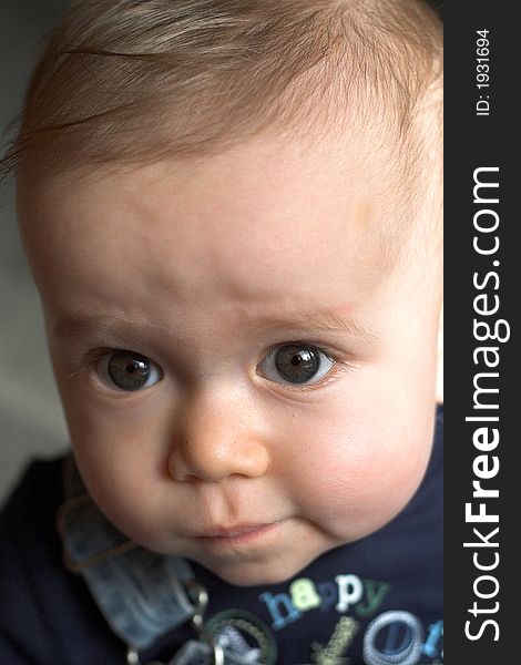 Image of cute baby boy wearing overalls. Image of cute baby boy wearing overalls