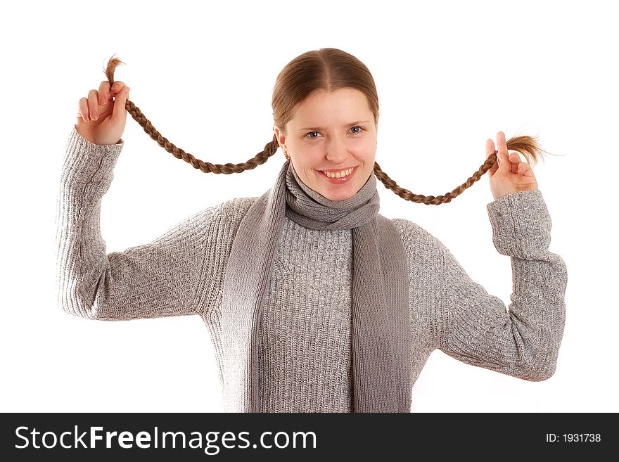 Cute young woman holding her hair plaits