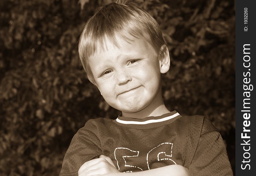 Young blonde boy done in sepia with expression