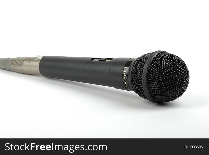 Black microphone on awhite background.