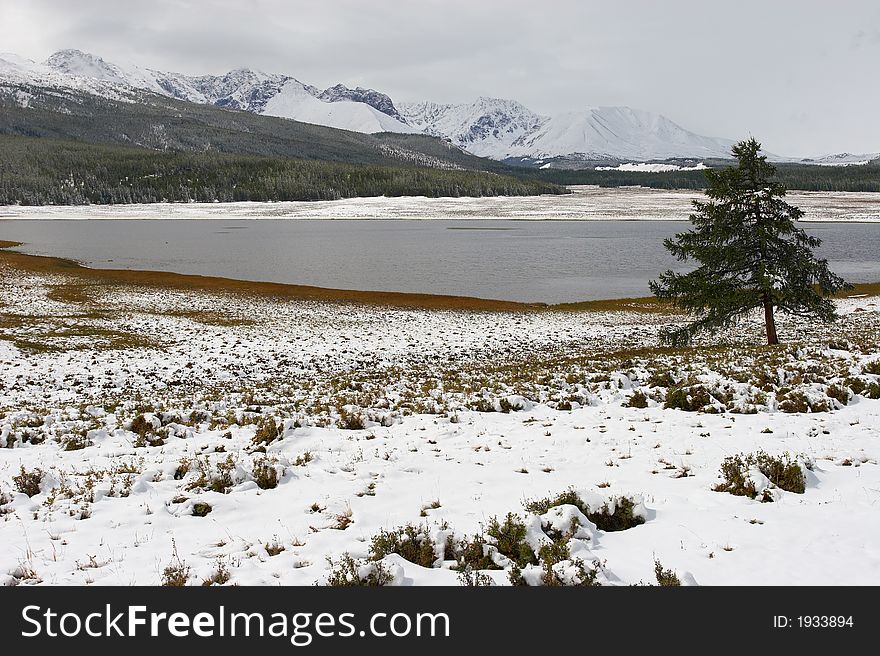 Winter lake and mountains. Altay. Russia.