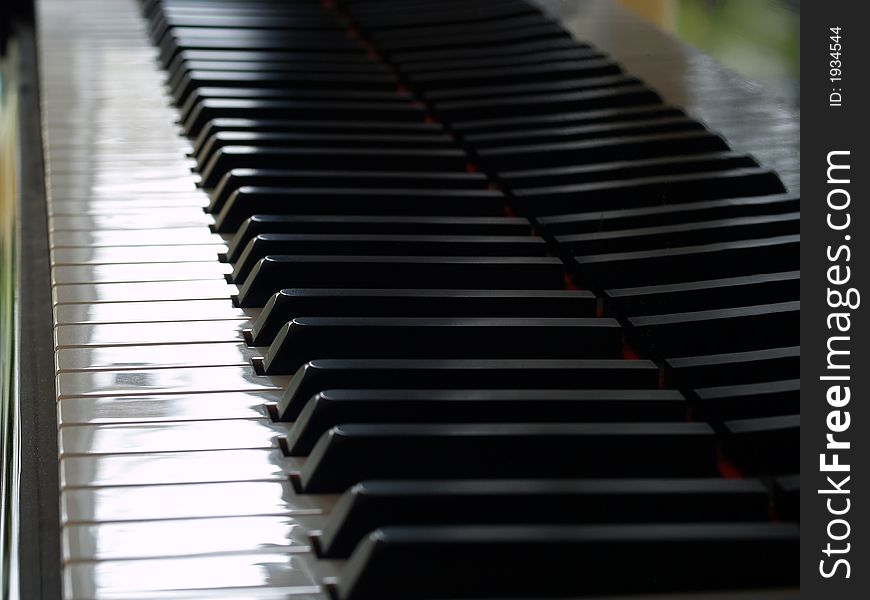 Piano key's reflecting in the piano