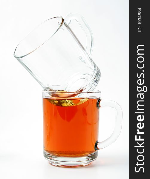 Twoo glass mugs and black tea, Isolated