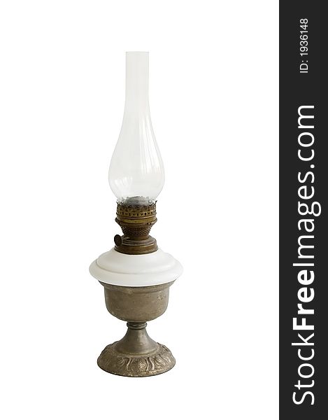 The old kerosene oil lamp isolated over white. The old kerosene oil lamp isolated over white