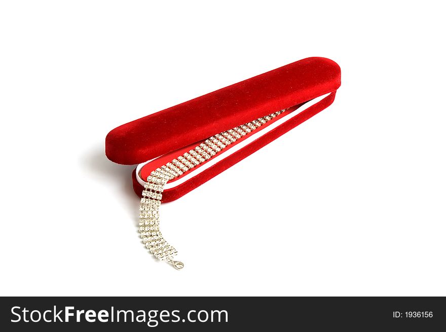 Open red gift box with bracelet isolated over white