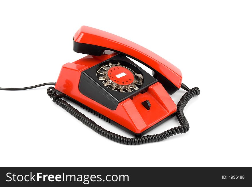Old styled red telephone isolated over white