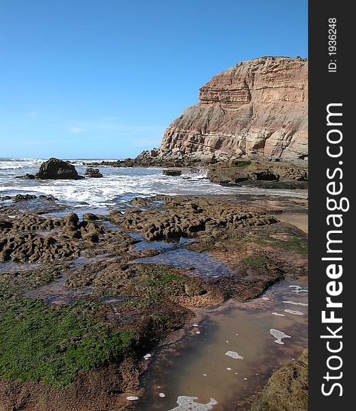 The Atlantic Ocean rocky coast in the summer. The Atlantic Ocean rocky coast in the summer.