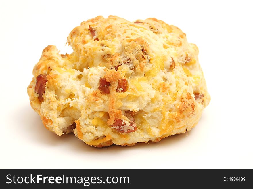 Single sausage cheese biscuit on white