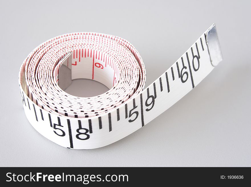 Measuring tape on gray background. Measuring tape on gray background
