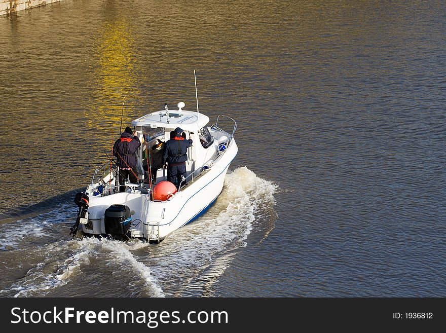 Small fishing boat with fishermen on board. Small fishing boat with fishermen on board