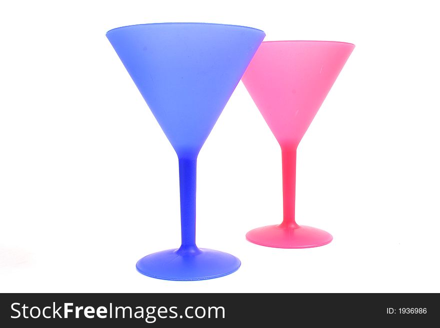 Shot of colorful cocktail glasses on white