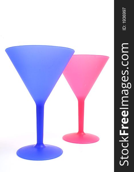 Shot of colorful cocktail glasses on white vertical