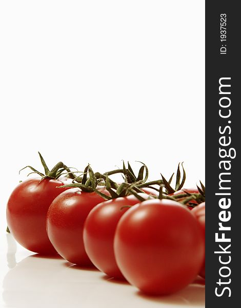 Red tomatoes over white background