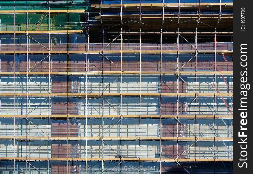 Large building sites scaffolding with brick work