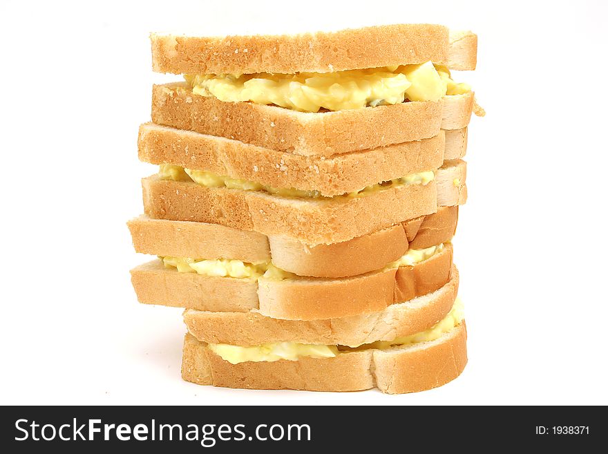 Shot of an egg salad sandwich stack snack