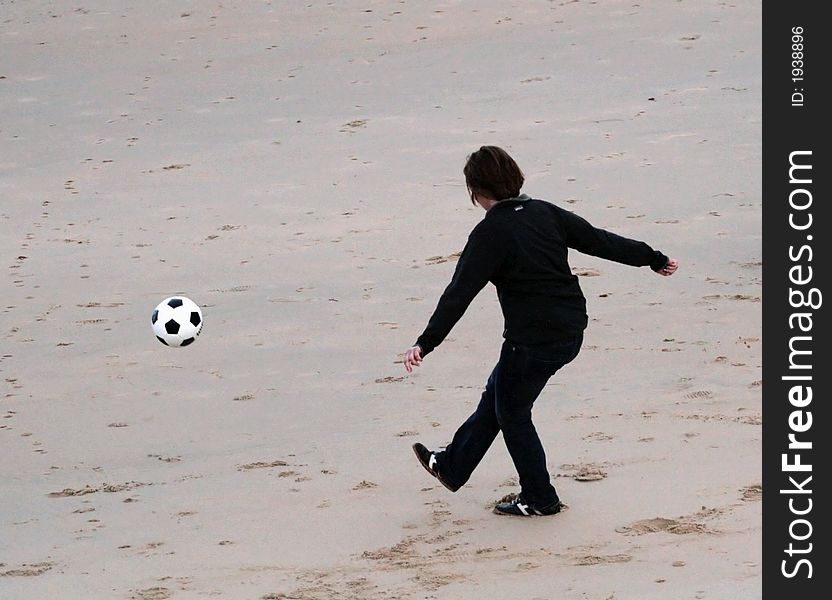 Playing soccer on the beach. Playing soccer on the beach