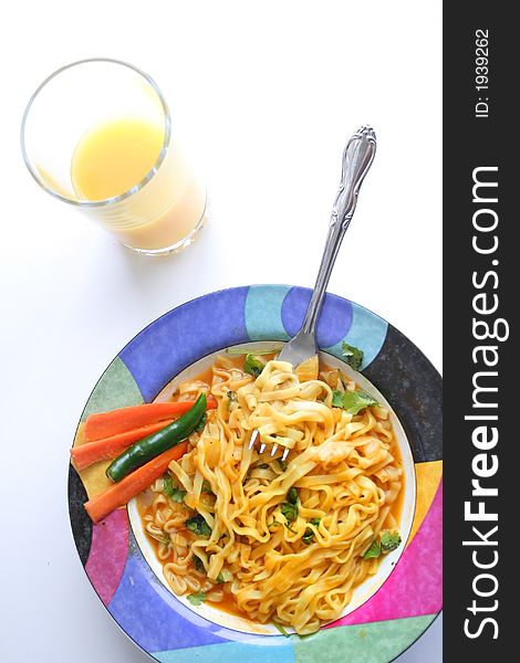 Asian style noodle breakfast and orange juice