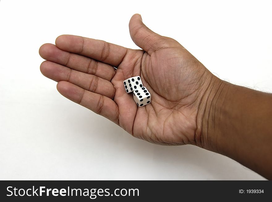 A pair of dice in a hand ready to be rolled