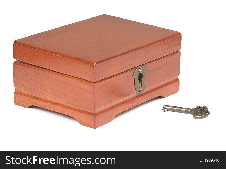 Wooden locker with key lying around, isolated over white