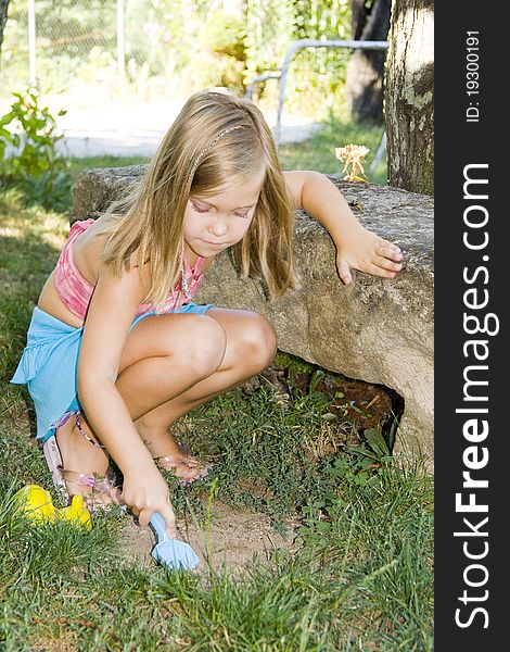 Blond girl playing in the park. Blond girl playing in the park