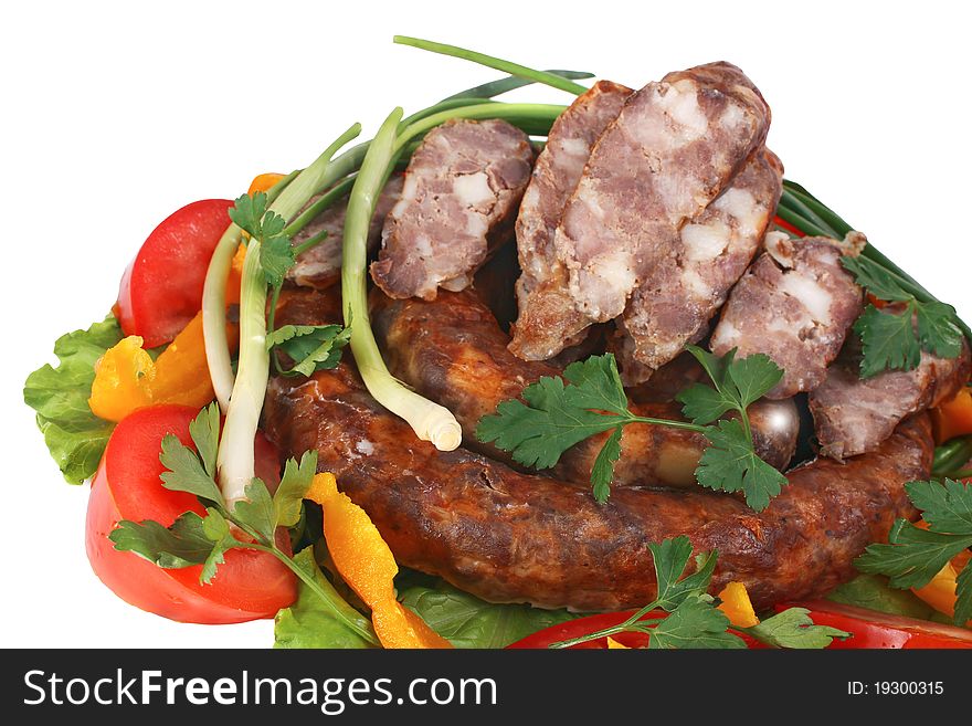 Fried sausage with vegetables isolated on white background