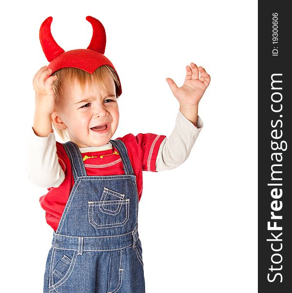 A crying boy in a funny hat. Isolated on a white background