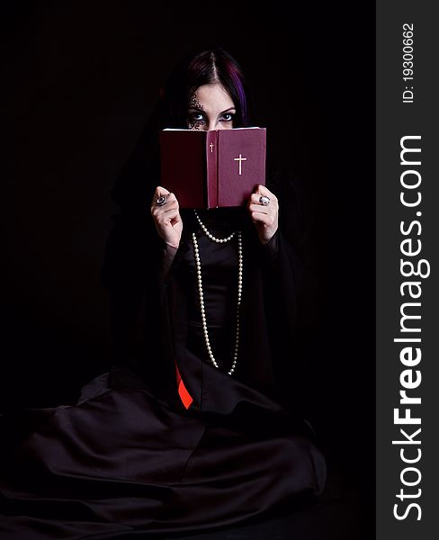 Gothic girl with the Bible