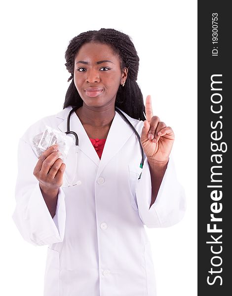 A young black woman with a condom in her hand. A young black woman with a condom in her hand