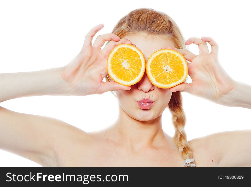 Young woman with oranges in her hands isolated on white