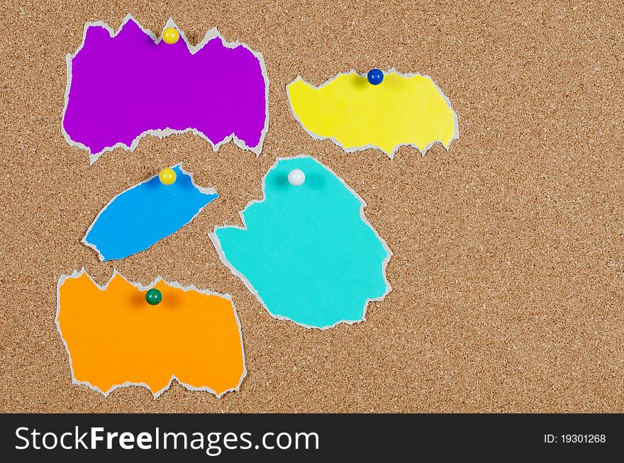 Collection of various note papers on corkboard background