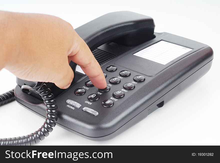 A hand dialing phone number isolated with white background