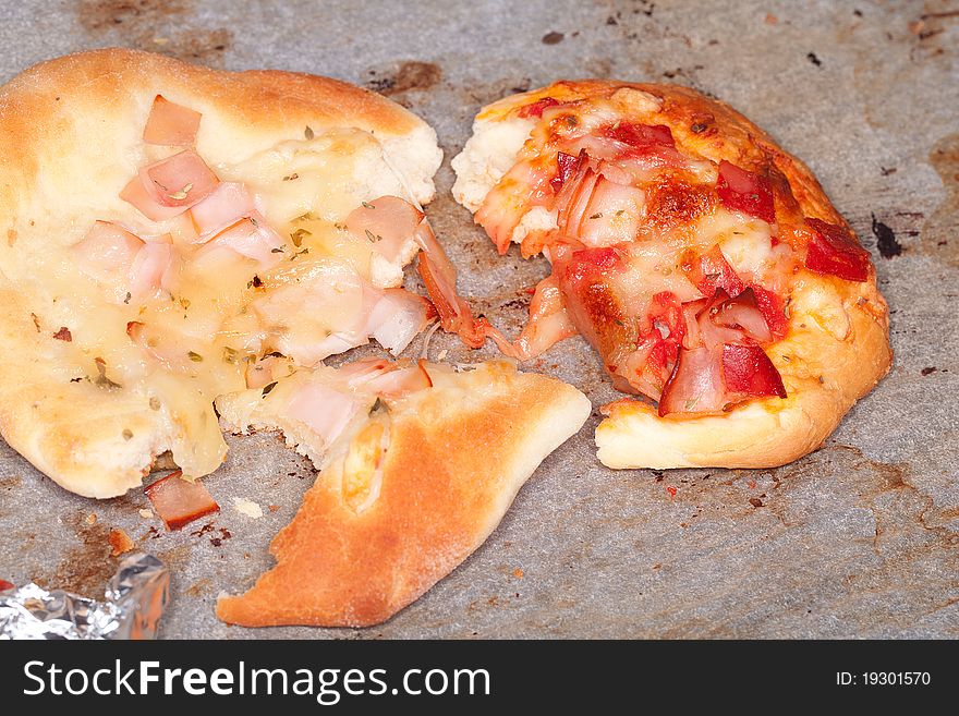 Mini pizza leftovers in a cardboard box. Mini pizza leftovers in a cardboard box