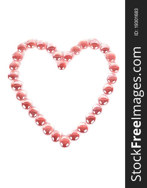 Abstract background with red glass balls heart shape, isolated