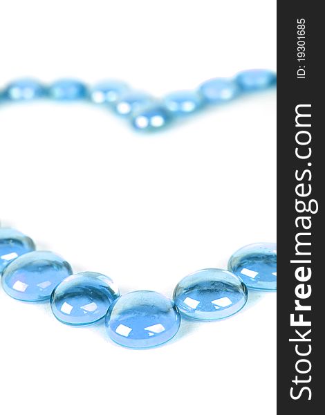 Abstract background with blue glass balls heart shape, isolated