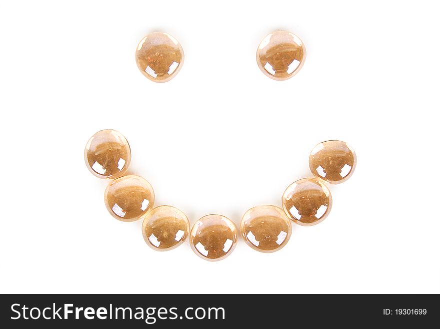 Abstract background with orange glass balls smiling face shape, isolated. Abstract background with orange glass balls smiling face shape, isolated