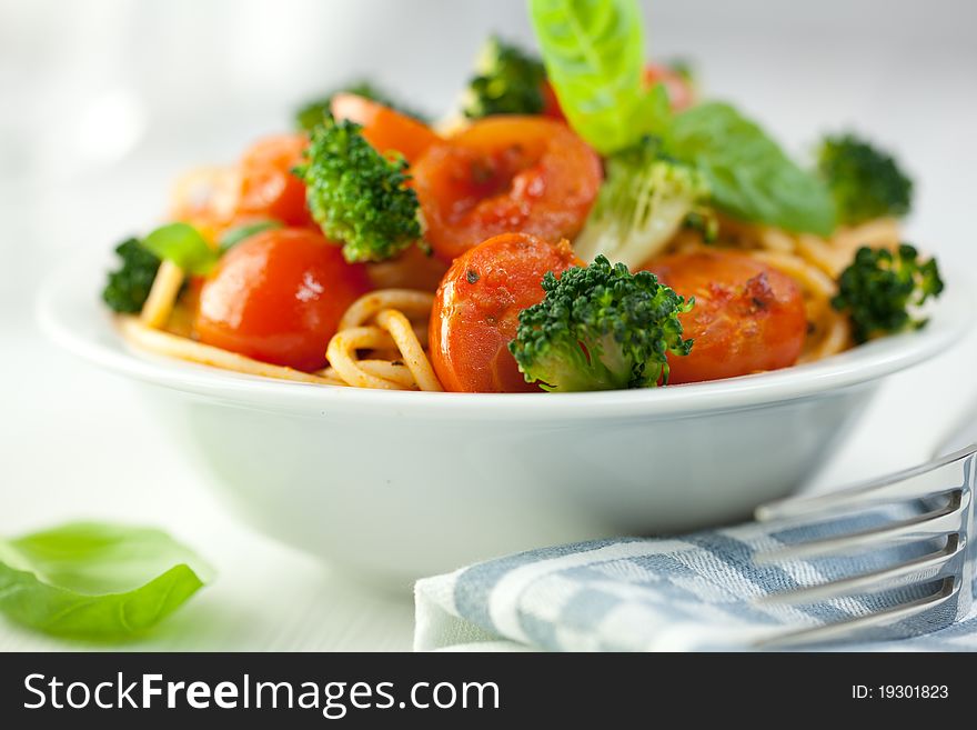 Spaghetti with vegetables flavoured with basil. Spaghetti with vegetables flavoured with basil